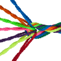 A multicolored braided string with the strands out at one end and wound together at the other.