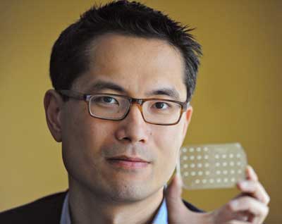 Samuel Sia holding an mChip device